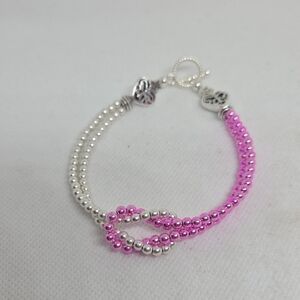 Pink and Silver Love Knot Beaded Bracelet In Plated Hematite Stone Beads.